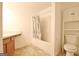 This bathroom features a shower-tub combination and vanity with cabinet storage at 131 Meadowbrook Ln, Grantville, GA 30220