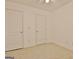 Carpeted bedroom featuring standard closet, ceiling fan, and electrical outlets at 131 Meadowbrook Ln, Grantville, GA 30220