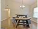 Dining room with a modern table set under a chandelier, offering seating and style at 131 Meadowbrook Ln, Grantville, GA 30220