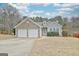 Charming single-Gathering home with a two-car garage and beautiful stone detailing on a bright, sunny day at 131 Meadowbrook Ln, Grantville, GA 30220
