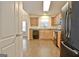Well-lit kitchen featuring wood cabinets and modern black appliances at 131 Meadowbrook Ln, Grantville, GA 30220
