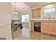 Kitchen view leading into dining area with ample lighting and appliances at 131 Meadowbrook Ln, Grantville, GA 30220