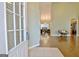 View from the doorway into the open living room with hardwood floors and access to dining room and kitchen at 131 Meadowbrook Ln, Grantville, GA 30220
