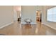 Hardwood flooring in a living area offering a view into the dining and kitchen areas at 131 Meadowbrook Ln, Grantville, GA 30220