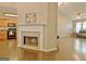 Open-concept living space with hardwood floors, fireplace, and view into kitchen at 131 Meadowbrook Ln, Grantville, GA 30220