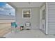 View of covered patio with outdoor seating at 131 Meadowbrook Ln, Grantville, GA 30220