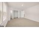 Bright bedroom features neutral carpet, base trim, and closet at 1817 Quaker St, Hampton, GA 30228