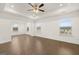Large bedroom with trey ceiling and hardwood flooring at 1817 Quaker St, Hampton, GA 30228