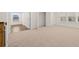 Bright, carpeted bedroom features an open closet at 1817 Quaker St, Hampton, GA 30228
