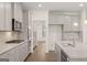 Modern kitchen featuring granite countertops, stainless steel appliances, and ample cabinet space at 1817 Quaker St, Hampton, GA 30228