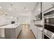 Open kitchen with stainless steel appliances, granite countertops, and an island at 1817 Quaker St, Hampton, GA 30228