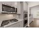 Modern kitchen features stainless steel appliances and granite countertops at 1817 Quaker St, Hampton, GA 30228