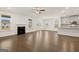 Bright living room with a cozy fireplace and stainless steel appliances at 1817 Quaker St, Hampton, GA 30228