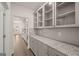 Spacious pantry with granite countertops, ample storage and lighting at 1817 Quaker St, Hampton, GA 30228