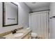 Bathroom featuring granite countertop, vanity and shower with white curtain at 127 Grayson Myers Dr, Villa Rica, GA 30180