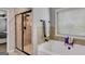 Bright bathroom showcasing a separate walk-in shower and luxurious soaking tub for ultimate relaxation at 127 Grayson Myers Dr, Villa Rica, GA 30180