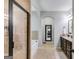 Elegant bathroom with a tiled walk-in shower, soaking tub, and stylish vanity for a spa-like experience at 127 Grayson Myers Dr, Villa Rica, GA 30180