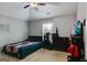 Modern bedroom featuring vaulted ceiling, ceiling fan, and sleek black furniture at 127 Grayson Myers Dr, Villa Rica, GA 30180