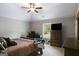 Bedroom features vaulted ceiling, ceiling fan, and television on chest of drawers at 127 Grayson Myers Dr, Villa Rica, GA 30180