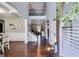 Bright foyer with hardwood floors, a staircase, and a view into the living room and dining room at 127 Grayson Myers Dr, Villa Rica, GA 30180