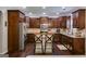 Modern kitchen features stainless steel appliances, dark cabinets, and a central island at 127 Grayson Myers Dr, Villa Rica, GA 30180