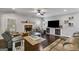 Comfortable living room features a stone fireplace, TV, and recessed lighting at 127 Grayson Myers Dr, Villa Rica, GA 30180