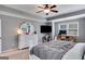 Comfortable main bedroom features a plush bed, a television, and ample space for relaxation at 127 Grayson Myers Dr, Villa Rica, GA 30180