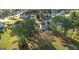 Aerial view of the home nestled among mature trees on a beautifully landscaped lot at 176 Fairoaks Cir, Stockbridge, GA 30281