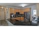 Kitchen featuring granite countertops, stainless steel appliances, and natural wood cabinets at 176 Fairoaks Cir, Stockbridge, GA 30281