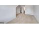 Bright bedroom featuring neutral carpet, white walls, and multiple doors leading to other rooms at 1812 Quaker St, Hampton, GA 30228
