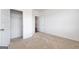 Bedroom featuring neutral carpet, white walls, and a closet at 1812 Quaker St, Hampton, GA 30228