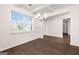 Open dining room with coffered ceiling and dark hardwood floors at 1812 Quaker St, Hampton, GA 30228