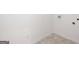 Unfinished laundry area with tile floors and hookups for a washer and dryer at 1812 Quaker St, Hampton, GA 30228