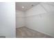 Spacious walk-in closet with carpet flooring and white shelving units for organized storage at 1812 Quaker St, Hampton, GA 30228