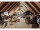 Spacious attic with exposed beams and ample storage for clothes, bins, and boxes at 2371 Leguin Mill Rd, Locust Grove, GA 30248