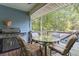 Outdoor deck featuring a grill, seating, and view of the surrounding greenery at 2371 Leguin Mill Rd, Locust Grove, GA 30248