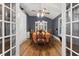 Spacious dining room with wood floors, a ceiling fan, and built in storage at 2371 Leguin Mill Rd, Locust Grove, GA 30248