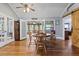 Light filled dining room with wood floors, barn door and french doors to the outside at 2371 Leguin Mill Rd, Locust Grove, GA 30248
