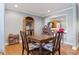 Dining room with hardwood floors, display case, and pass through to the next room at 2371 Leguin Mill Rd, Locust Grove, GA 30248