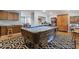 Large game room with a pool table, kitchenette, and view into dining area at 2371 Leguin Mill Rd, Locust Grove, GA 30248