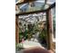 Inside Nana's Greenhouse featuring a variety of plants in pots at 2371 Leguin Mill Rd, Locust Grove, GA 30248