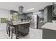 Kitchen featuring gray cabinetry, stainless appliances, and center island with seating at 2371 Leguin Mill Rd, Locust Grove, GA 30248