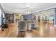 Large living room with hardwood floors, stone fireplace, and open layout at 2371 Leguin Mill Rd, Locust Grove, GA 30248