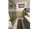 Bathroom featuring glass enclosed shower, tile flooring, and gray vanity at 6444 Charter Way, Lithonia, GA 30058