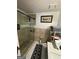 Bathroom featuring glass enclosed shower, tile flooring, and gray vanity at 6444 Charter Way, Lithonia, GA 30058