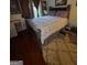 Bedroom with gray furnishings, floral bedding, and wood floors at 6444 Charter Way, Lithonia, GA 30058