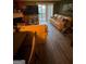 Bright living room featuring laminate wood floors, fireplace and sliding glass door to outside deck at 6444 Charter Way, Lithonia, GA 30058