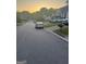 Neighborhood street view with well-maintained homes and mature trees at 6444 Charter Way, Lithonia, GA 30058