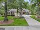 Traditional home boasts meticulous landscaping, a three car garage and stone accents at 115 Edgewood Pkwy, Fayetteville, GA 30215