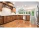 Bright kitchen with stainless steel appliances and wooden cabinets at 115 Edgewood Pkwy, Fayetteville, GA 30215